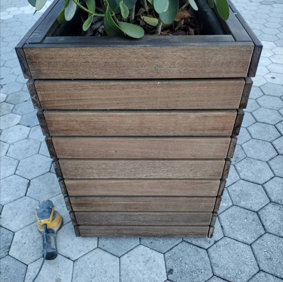 Sun-bleached, grey wooden planter